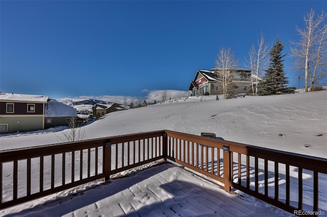 view of snow covered deck