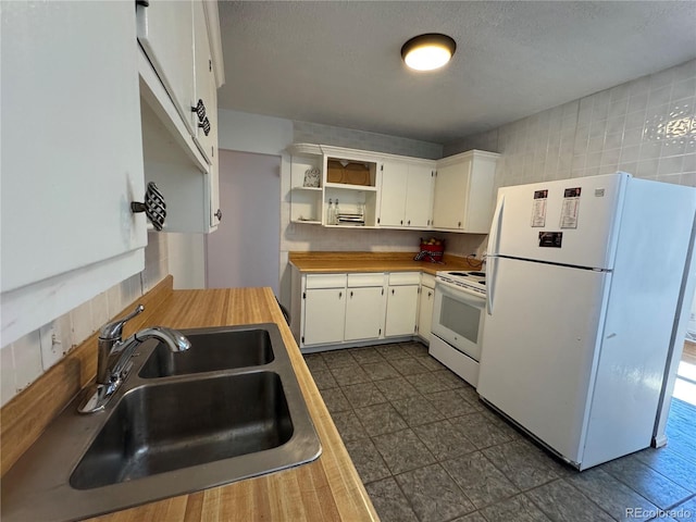 6213 Gray St, Arvada, CO 80003 - kitchen featuring white appliances, a sink, open shelves, white cabinetry, and a textured ceiling