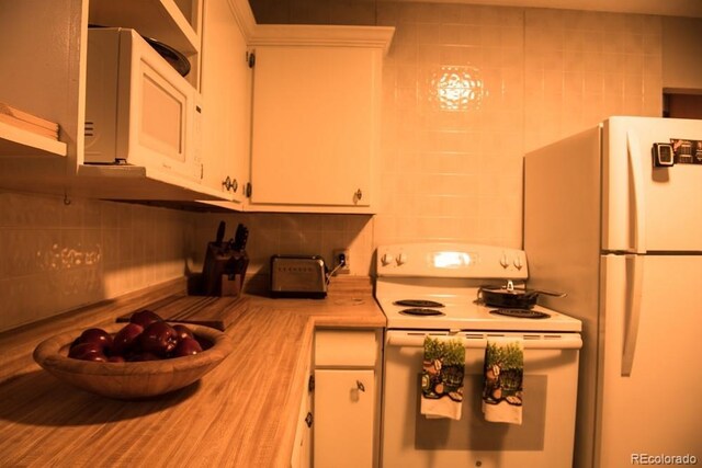 6213 Gray St, Arvada, CO 80003 - kitchen featuring white appliances, light countertops, white cabinetry, and decorative backsplash