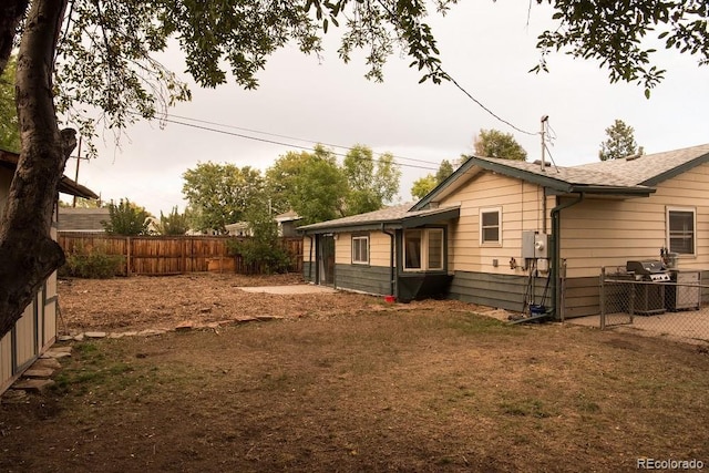6213 Gray St, Arvada, CO 80003 - view of side of home with a fenced backyard
