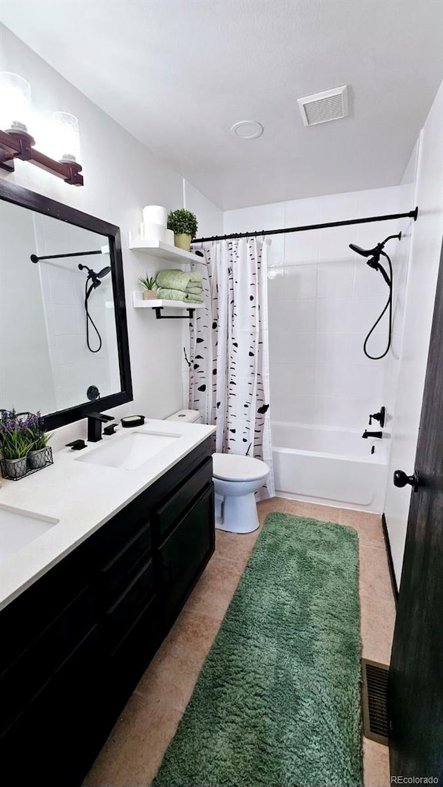 full bathroom with tile patterned floors, toilet, shower / tub combo with curtain, and vanity