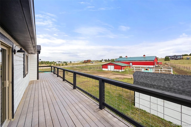 wooden terrace with an outbuilding