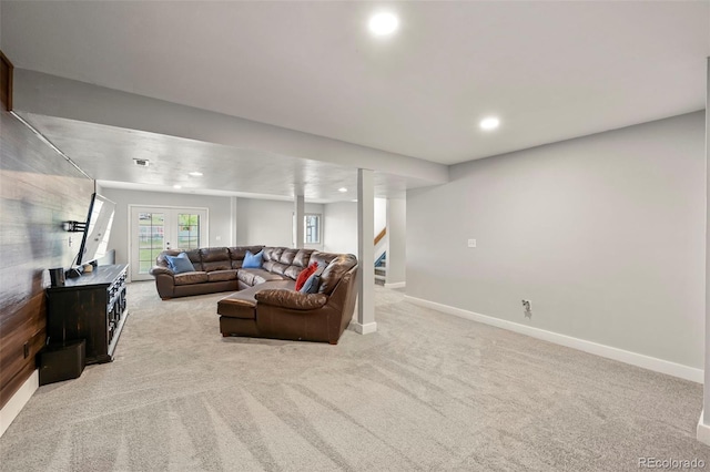 living room featuring light carpet and french doors