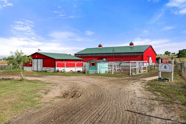 view of outbuilding featuring an outdoor structure and driveway