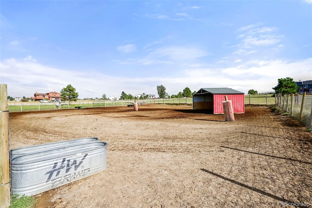 view of yard with a storage unit