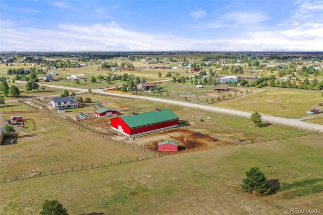 birds eye view of property with a rural view