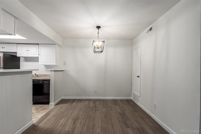 910 S Walden St Unit 106, Aurora, CO 80017 - unfurnished dining area featuring wood finished floors and baseboards