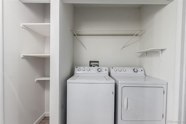 910 S Walden St Unit 106, Aurora, CO 80017 - laundry area with separate washer and dryer and baseboards