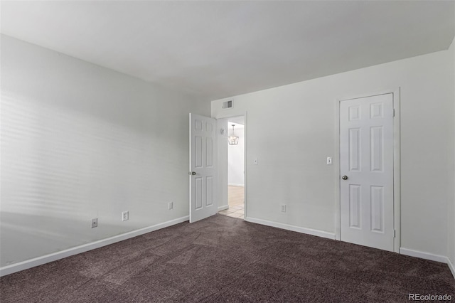 910 S Walden St Unit 106, Aurora, CO 80017 - unfurnished room with dark carpet and baseboards