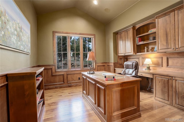28800 Stonecrop Trl, Conifer, CO 80433 - office space with light wood-style floors, wainscoting, vaulted ceiling, and built in study area