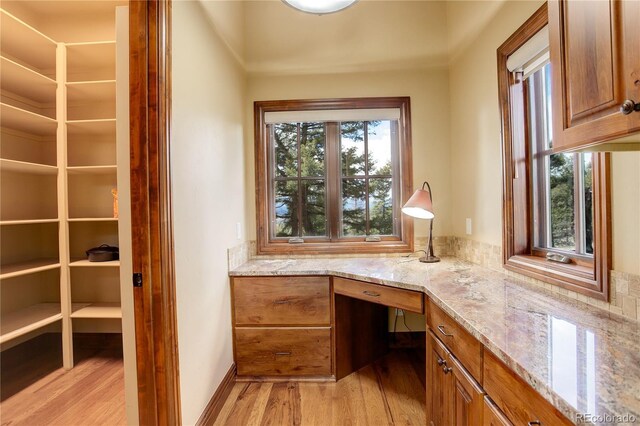 28800 Stonecrop Trl, Conifer, CO 80433 - unfurnished office featuring light wood-type flooring and built in study area