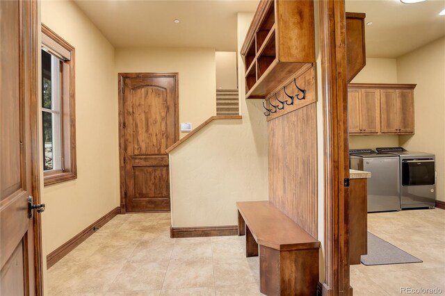 28800 Stonecrop Trl, Conifer, CO 80433 - mudroom with washer and dryer, baseboards, and recessed lighting