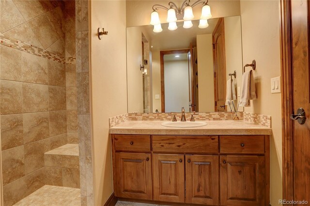 28800 Stonecrop Trl, Conifer, CO 80433 - bathroom featuring vanity and tiled shower
