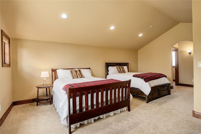 28800 Stonecrop Trl, Conifer, CO 80433 - carpeted bedroom featuring arched walkways, baseboards, vaulted ceiling, and recessed lighting