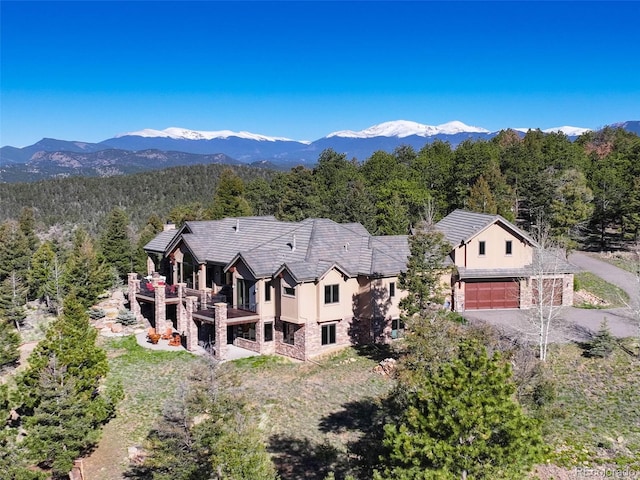 28800 Stonecrop Trl, Conifer, CO 80433 - aerial view of property and surrounding area with a forest and a mountain backdrop