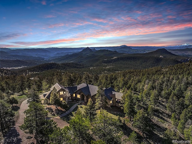 28800 Stonecrop Trl, Conifer, CO 80433 - view of subject property with a mountain backdrop and a forest