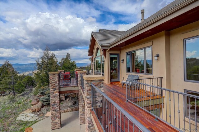 28800 Stonecrop Trl, Conifer, CO 80433 - wooden deck featuring a mountain view and stairs