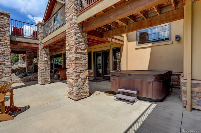 28800 Stonecrop Trl, Conifer, CO 80433 - view of patio with a hot tub and a balcony
