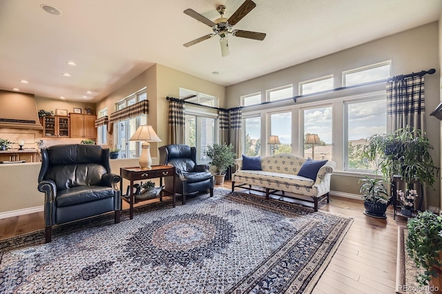 11070 Meade Ct, Westminster, CO 80031 - living area with wood finished floors, plenty of natural light, ceiling fan, and recessed lighting