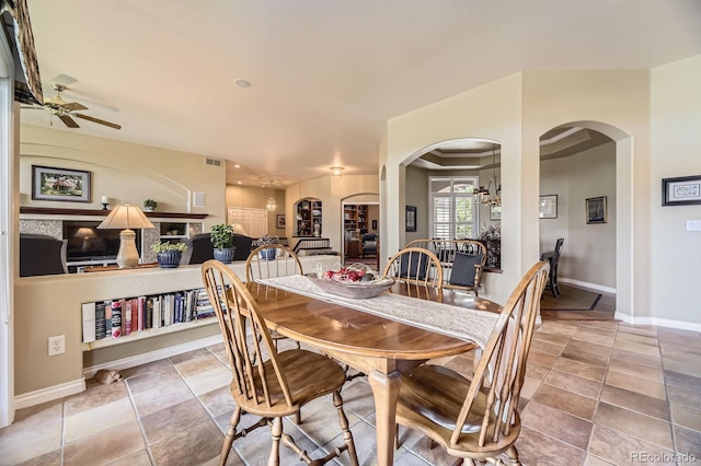11070 Meade Ct, Westminster, CO 80031 - dining room with arched walkways and ceiling fan