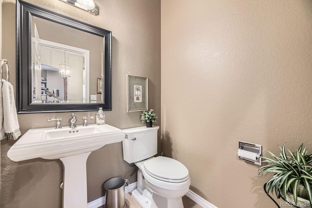 11070 Meade Ct, Westminster, CO 80031 - bathroom with toilet and a textured wall