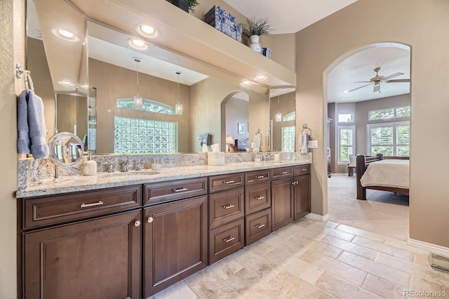 11070 Meade Ct, Westminster, CO 80031 - bathroom featuring double vanity, connected bathroom, a ceiling fan, and recessed lighting