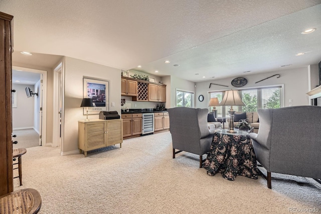 11070 Meade Ct, Westminster, CO 80031 - living area featuring wine cooler, bar with sink, light carpet, a textured ceiling, and recessed lighting