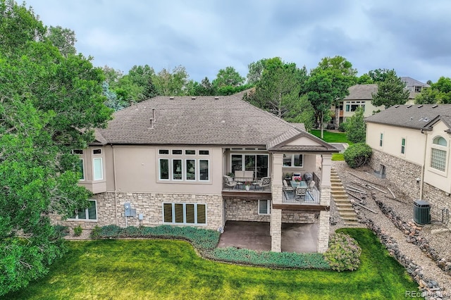 11070 Meade Ct, Westminster, CO 80031 - rear view of property with a patio, stucco siding, a lawn, a shingled roof, and stone siding