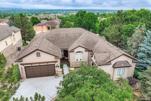 11070 Meade Ct, Westminster, CO 80031 - view of front of property with stucco siding, stone siding, concrete driveway, and an attached garage