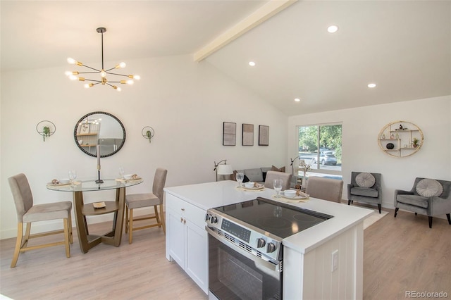 kitchen featuring light wood-type flooring, white cabinetry, lofted ceiling with beams, and electric range