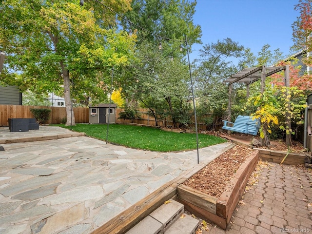 view of patio / terrace featuring a pergola and a shed