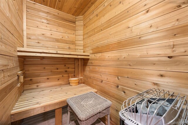 view of sauna / steam room with wood walls and wood ceiling