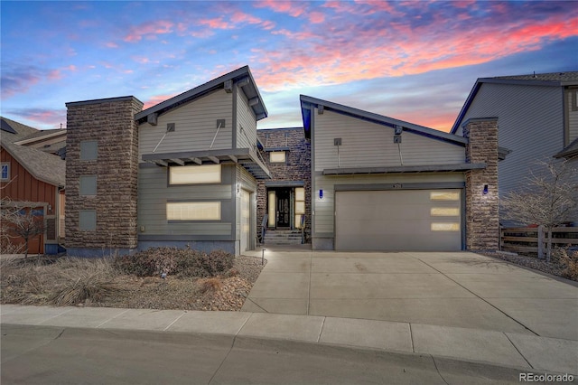 view of front of house featuring driveway and a garage