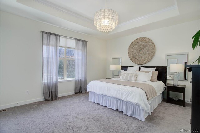 bedroom featuring crown molding, baseboards, light carpet, an inviting chandelier, and a raised ceiling