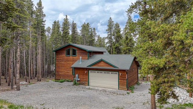 988 Ruby Ln, Leadville, CO 80461 - view of front facade with driveway, a garage, and a shingled roof