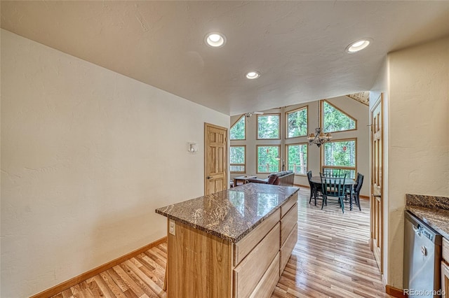 988 Ruby Ln, Leadville, CO 80461 - kitchen featuring light wood-type flooring, recessed lighting, a textured wall, a center island, and dark stone counters