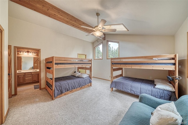 988 Ruby Ln, Leadville, CO 80461 - carpeted bedroom featuring vaulted ceiling, connected bathroom, a ceiling fan, and a skylight