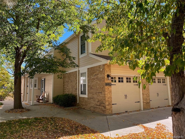 view of side of property with a garage