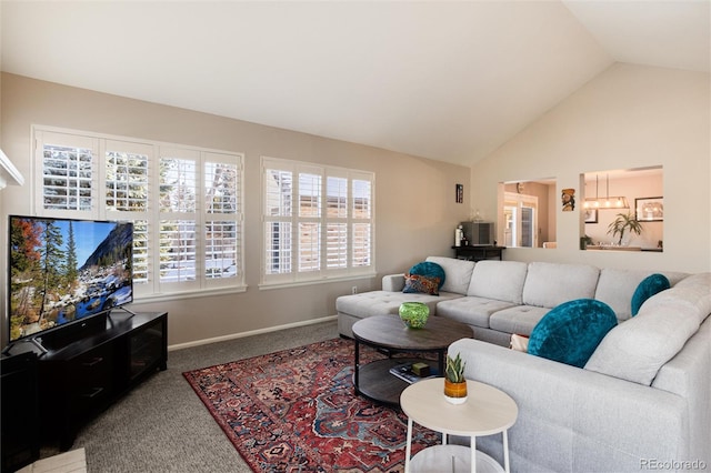 carpeted living room with vaulted ceiling