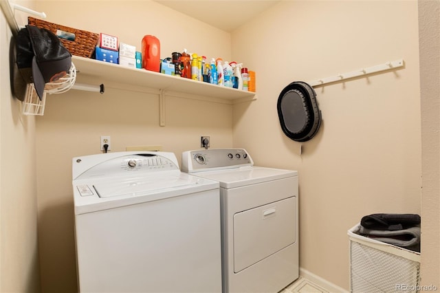 laundry room featuring separate washer and dryer