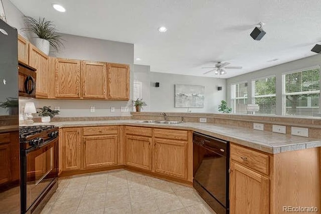 17225 Lark Water Ln Unit C, Parker, CO 80134 - kitchen featuring black appliances, a peninsula, ceiling fan, light tile patterned floors, and recessed lighting