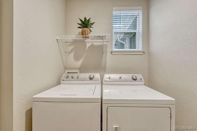 17225 Lark Water Ln Unit C, Parker, CO 80134 - laundry room with a textured wall and washer and clothes dryer