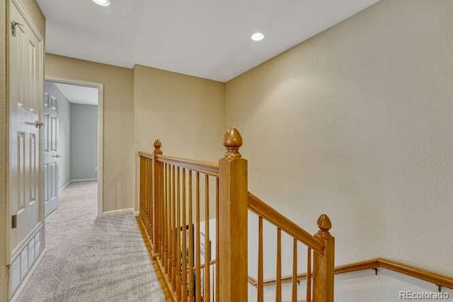 17225 Lark Water Ln Unit C, Parker, CO 80134 - hallway with an upstairs landing, light carpet, and recessed lighting