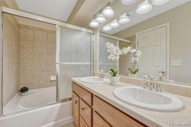 17225 Lark Water Ln Unit C, Parker, CO 80134 - bathroom featuring double vanity and combined bath / shower with glass door