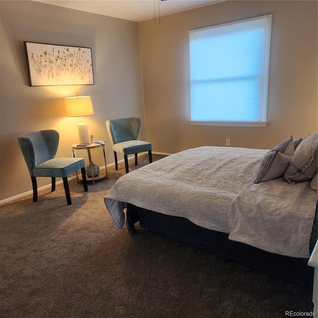 carpeted bedroom featuring baseboards