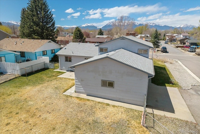 drone / aerial view with a residential view and a mountain view