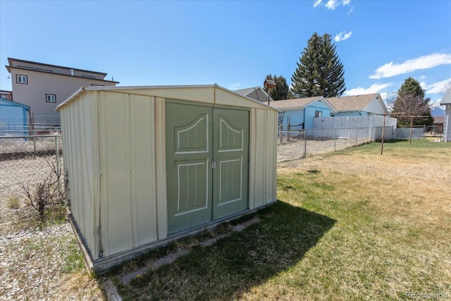 view of shed with fence