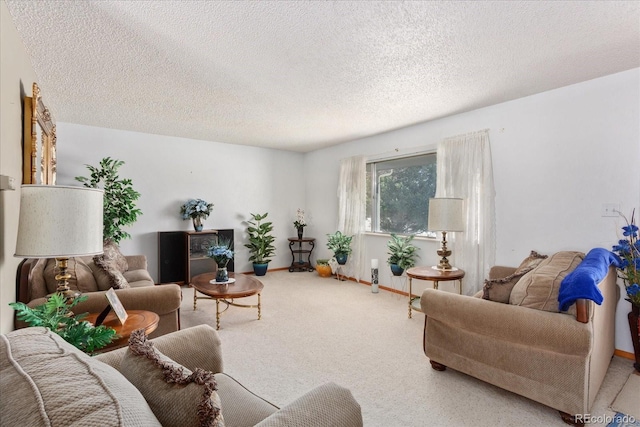 carpeted living room with a textured ceiling and baseboards