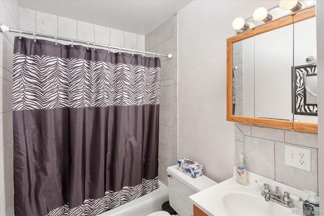 bathroom featuring vanity, toilet, and shower / tub combo