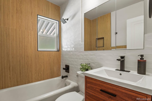 full bathroom featuring toilet, vanity,  shower combination, and decorative backsplash